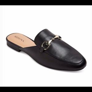 Black mules with gold buckle